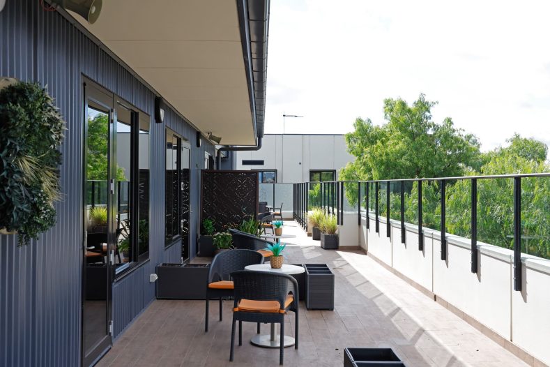 Communal balcony and entertainment space at Hawthorn Community