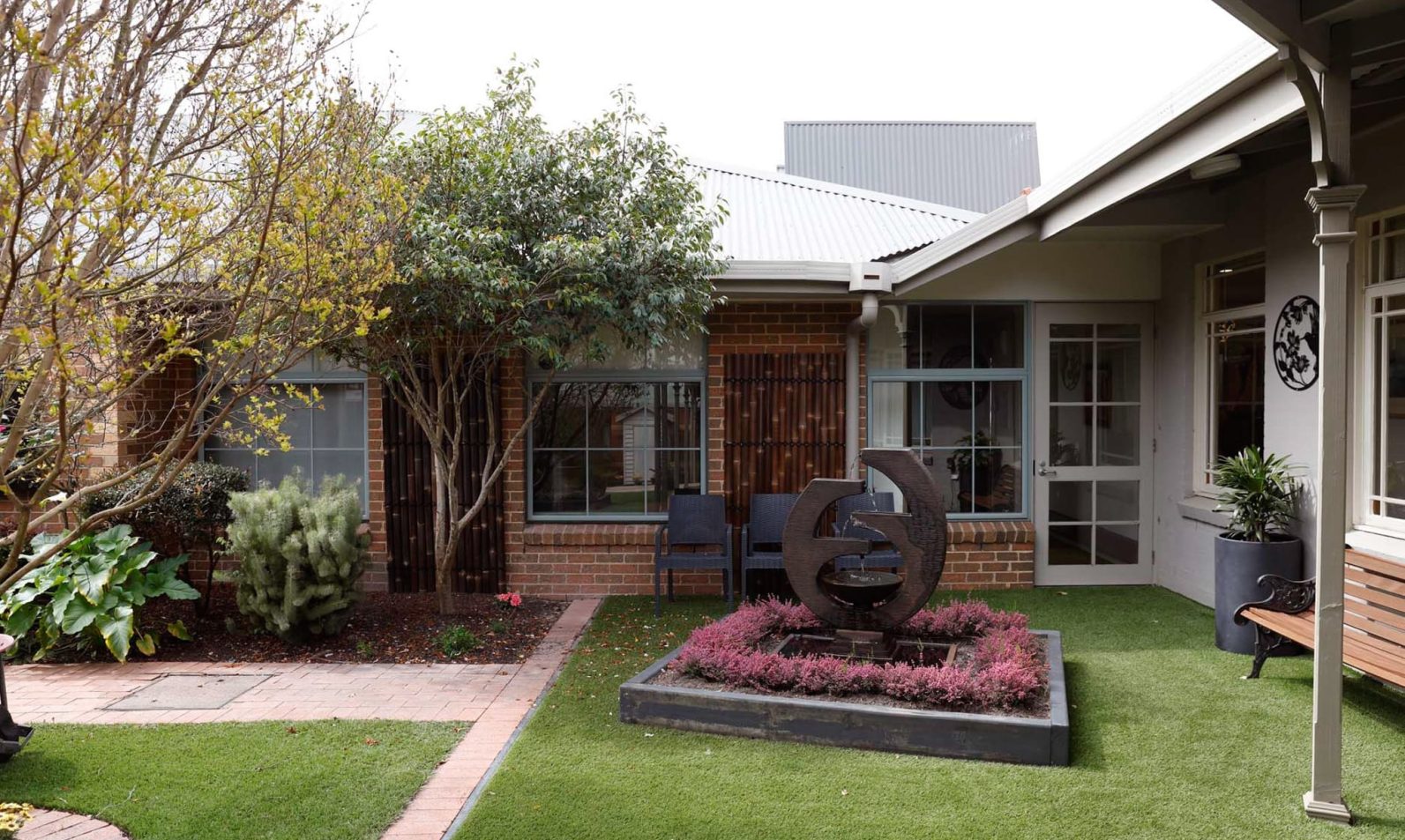 Beautiful sensory garden onsite with a fountain in the centre