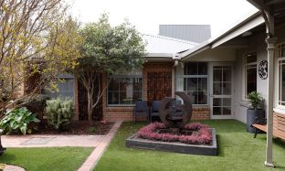 Beautiful sensory garden onsite with a fountain in the centre