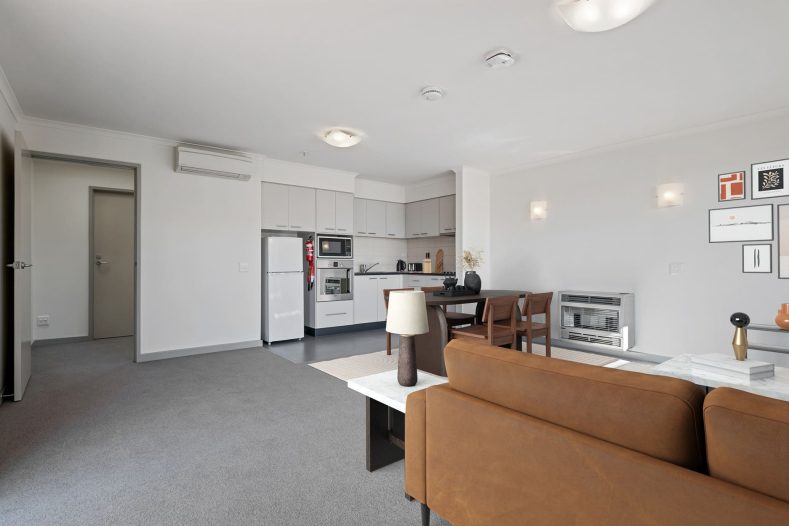 The open kitchen is photographed from the living room.