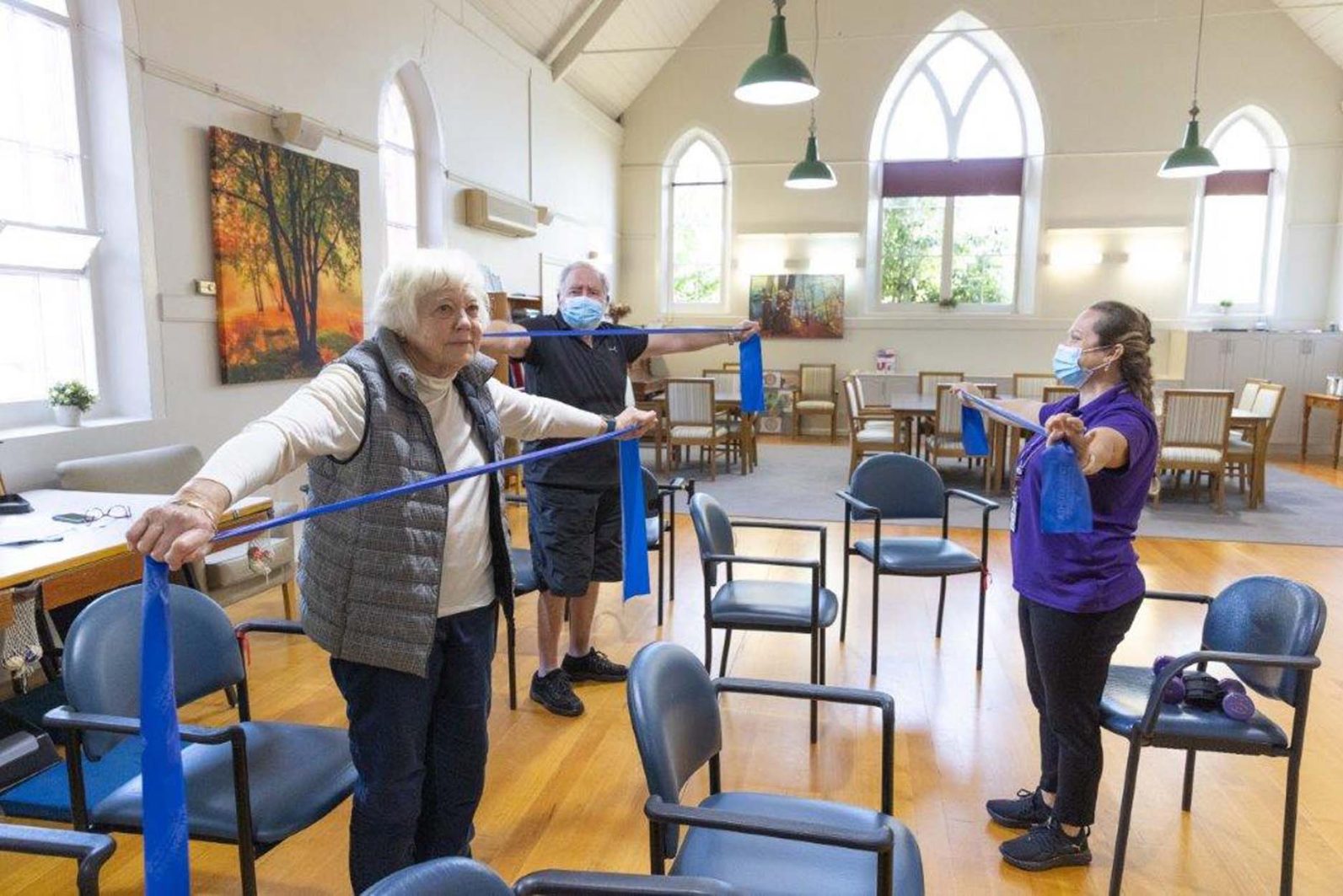 Customers are pictured stretching with a staff member.