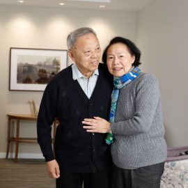 Two residents embrace