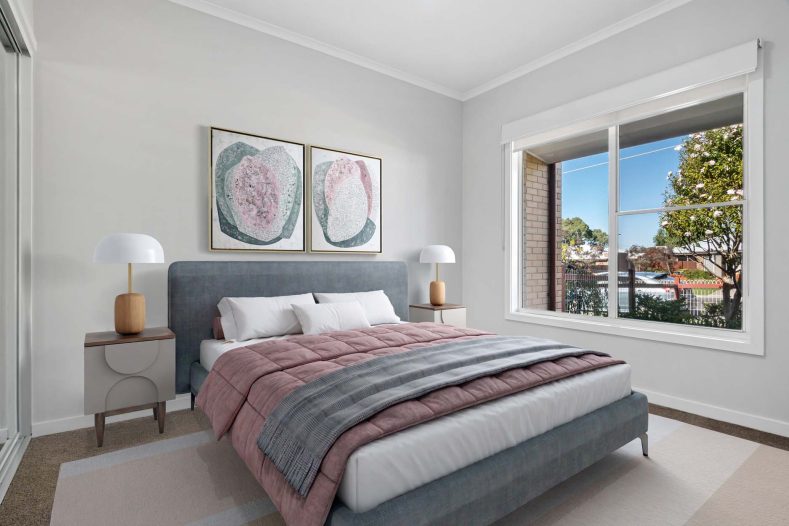 Kalkee ILU bedroom is photographed with a bed in the middle and a window on the side.