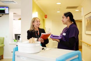 Two staff members are being photographed at Kingsville Community