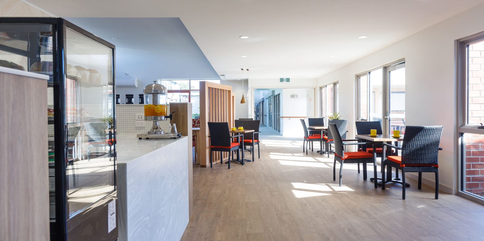 The dining area features a counter and tables