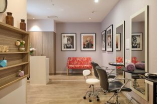 The image features the salon at Manor Lakes Community.