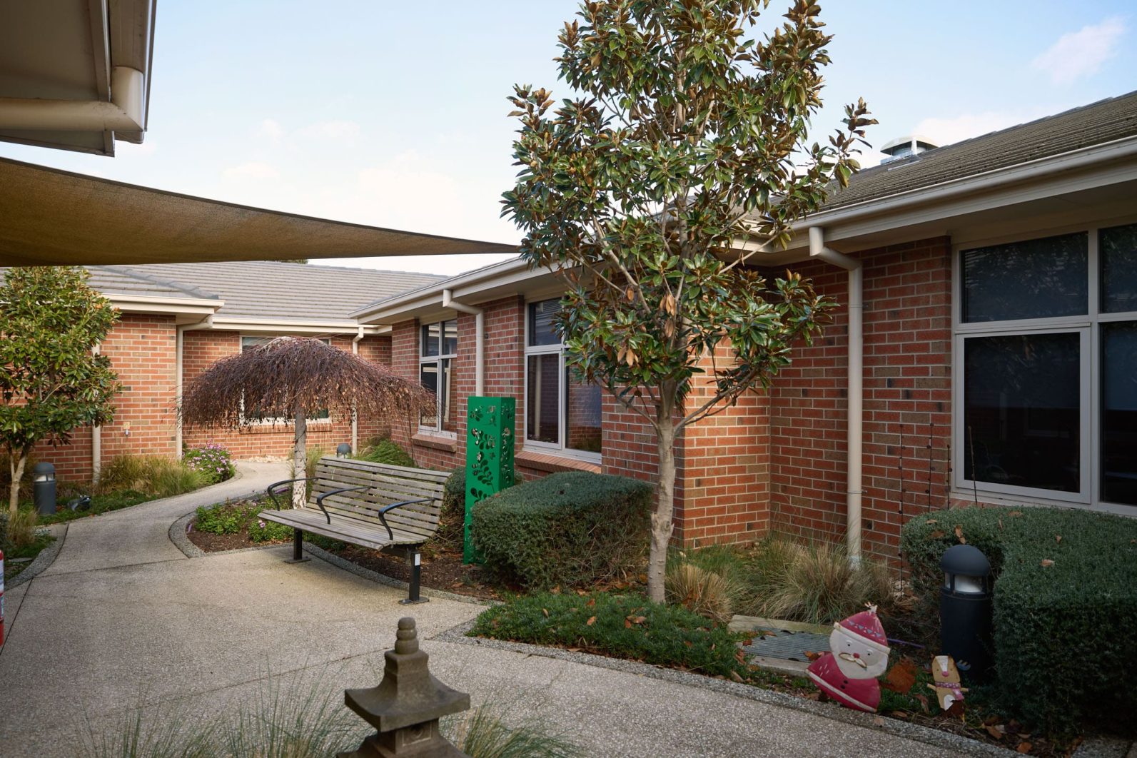 The image captures the outdoor area of Manor Lakes Community