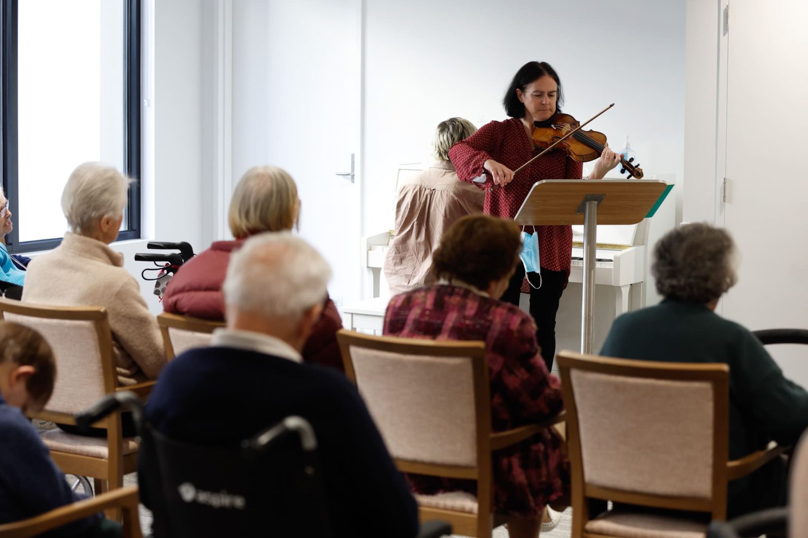Residents watch a music performance