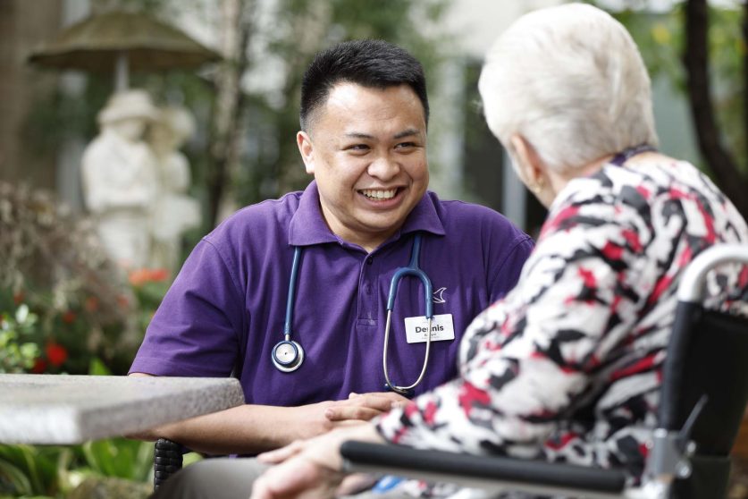 A staff member looks at a resident