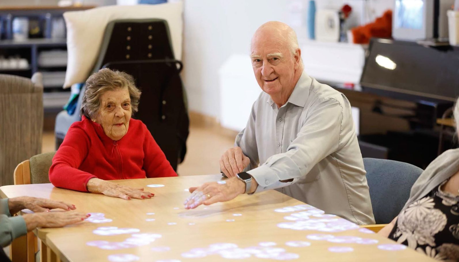 Residents are pictured playing cards togehter