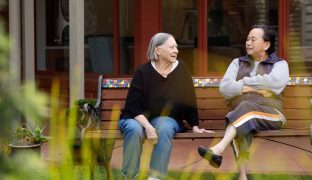 Residents are pictured sitting in the garden.