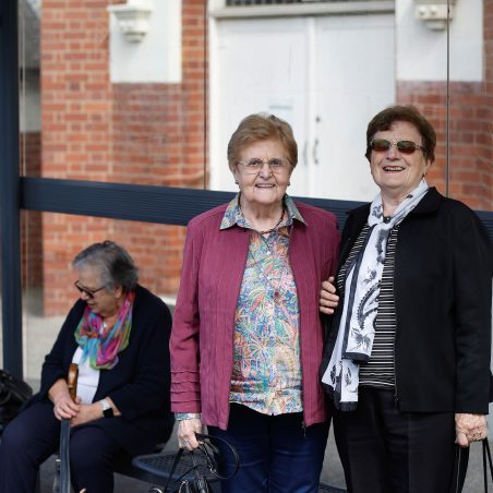 Social connections customers are pictured at a local bus stop.