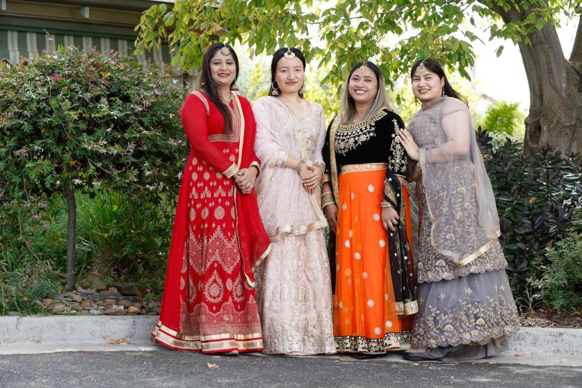 A group of Uniting AgeWell staff member is pictured in their traditional costumes.