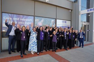 A group of Uniitng AgeWell employees are photographed in front of the new office in Swan Hill.