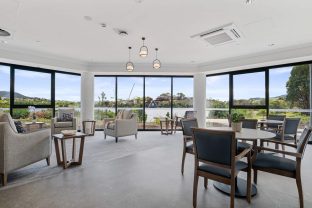 The lounge area features a few seating areas located near clear windows, where rivers and the surrounding landscapes are in sight.