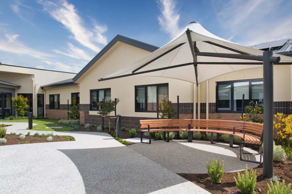 The new wing yard area is photographed, featuring the new building.