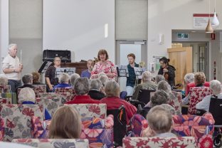 Residents watch a performance by the Tasmanian Symphony Orchestra.