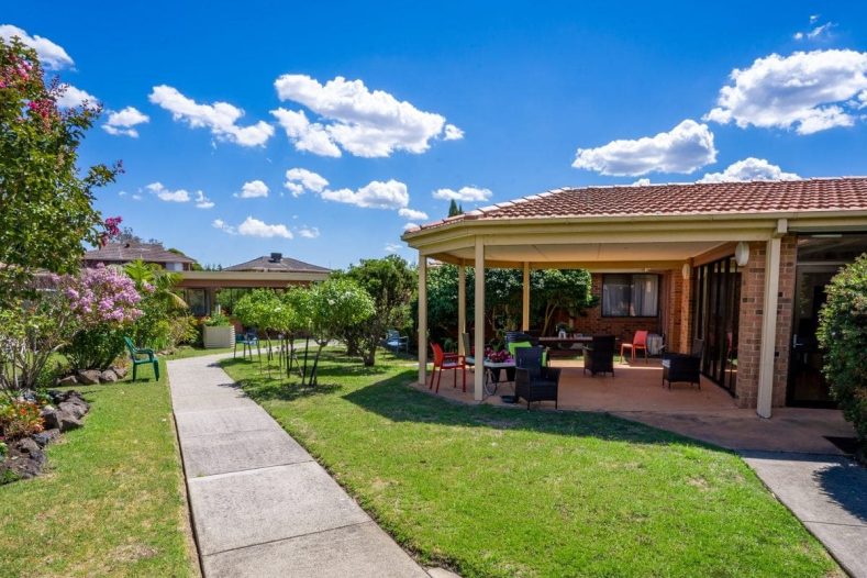 Latvian Community manicured garden and undercover seating area.