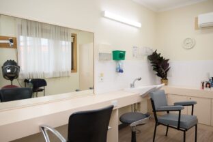 Close-up of the directional sign at the Latvian Community