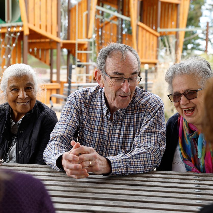 Social connections customers are pictured laughing as they chat
