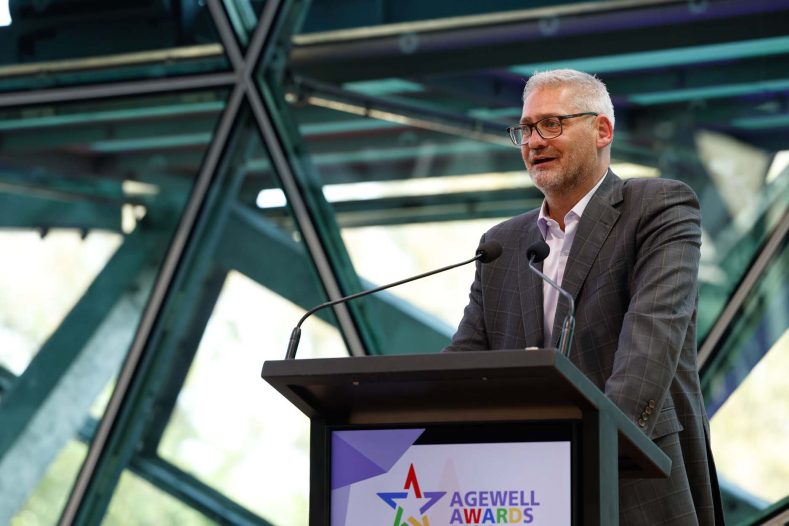 CEO Andrew Kinnersly is doing his speech on stage.