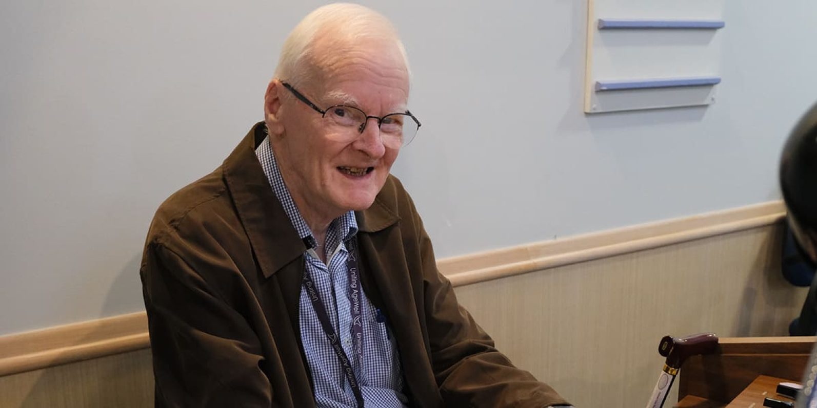 Volunteer pictured playing piano.