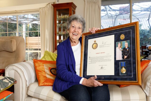 Mazza is photographed holding her awards