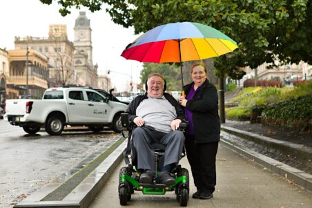 Rain, hail or shine – Norm, pictured with Home Care Worker Sally Wilkinson, knows he can rely on the team at Uniting AgeWell