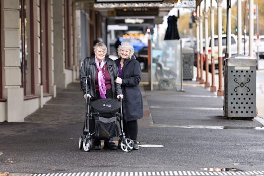Two people are photographed across the street in a local area of Ballarat.