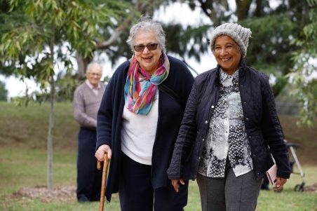 Social connections customers enjoying a walk in a local park.